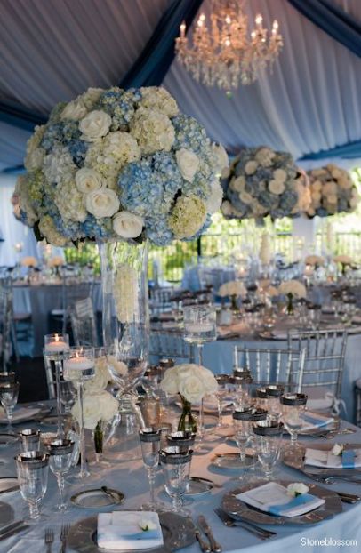 Lavish Blue and White Wedding Reception Table Centerpieces and Décor – shared in a roundup post on MODWEDDING