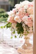 Pink Hydrangeas, Roses and Eucalyptus Filled Urns – shared on Elizabeth Anne Designs