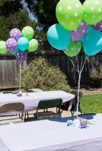 Green, Blue, and Purple Polka Dot Balloons with Dinosaur Weights as Table Décor – shared by Craftiness is not Optional