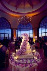 Purple Rose Wedding Cake on Flower Tablescape – shared by Colin Cowie Weddings
