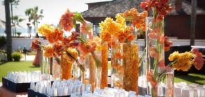 Submerged and Clustered Tropical Orange Flower Arrangements on Escort Table – shared by Karen Tran Florals