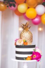 Colorful Tiered Cake with Black and White Stripes and a Golden Pineapple – shared by MidwestBride