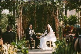 Overgrown Garden Wedding Altar with Vines and Greenery – shared in a roundup post on Huffington Post