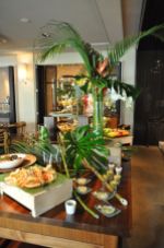 Green Tropical Palm Leaves and Wood Food Buffet and Display