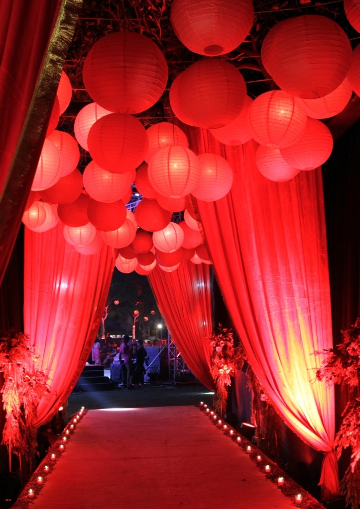 Red Paper Lanterns Reception Entrance with Red Drapery – shared on WedMeGood