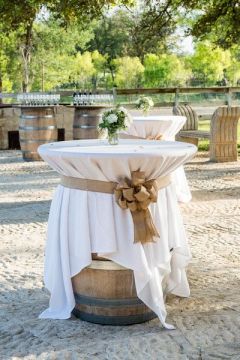 Cocktail Hour Tables of Wine Barrels – shared on Wedding Wire