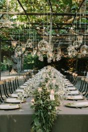 Tablescape of Floating Candles in Glass Bubbles Under Vines – shared by wedsource on Etsy